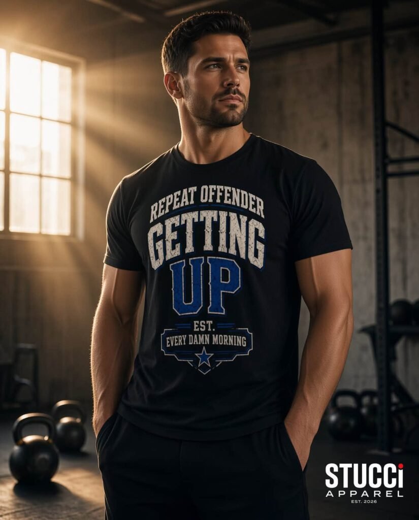Repeat Offender Varsity Tee in black on a model in a sunlit gym
