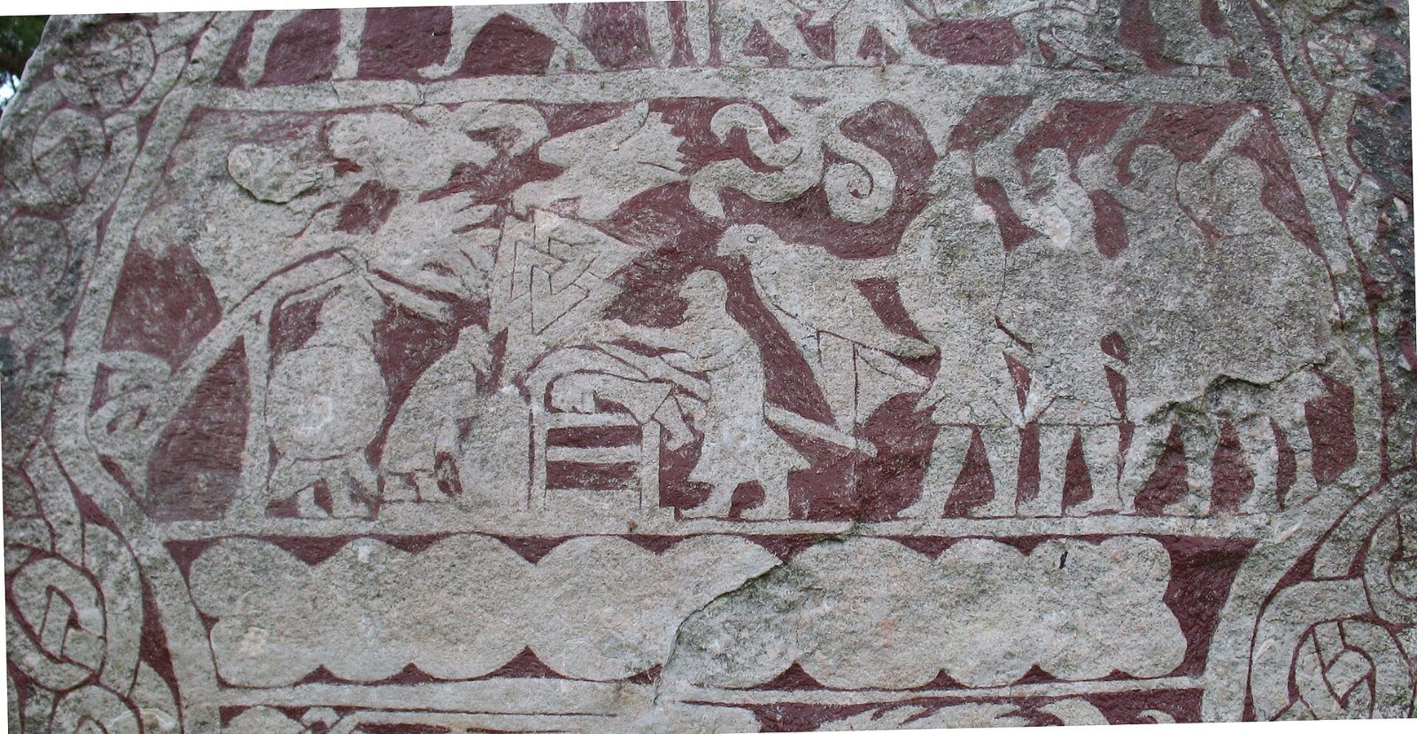 Valknut symbol carved over an altar in the sacrifice scene on the Stora Hammars I picture stone, Gotland